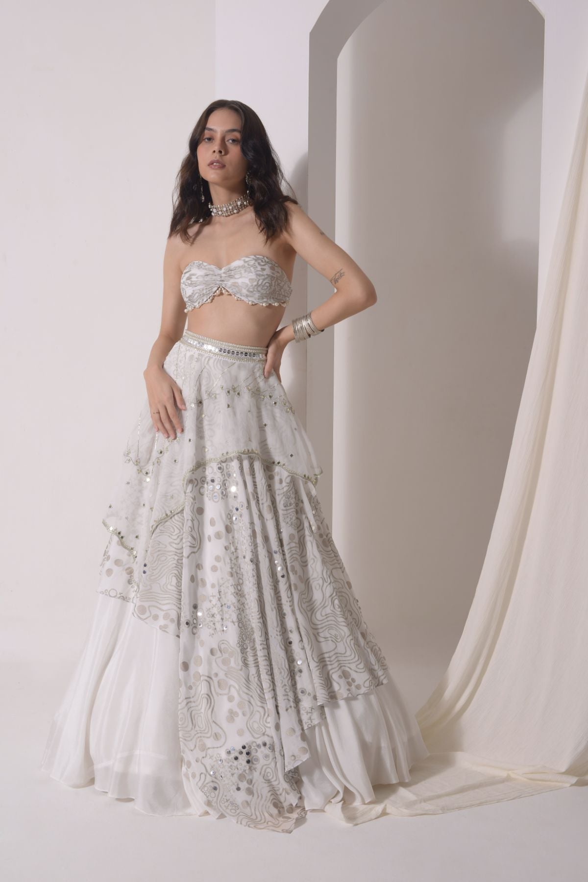Asymmetrical layered lehenga with foil printed ruched bustier and dupatta