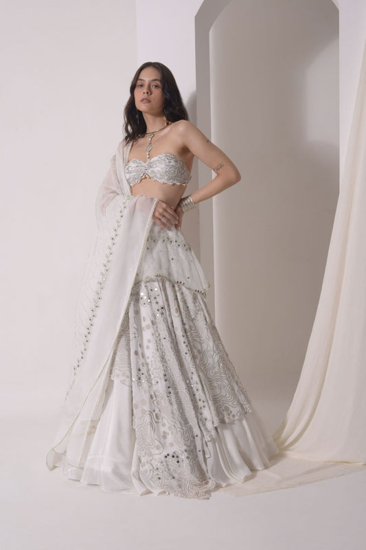 Asymmetrical layered lehenga with foil printed ruched bustier and dupatta