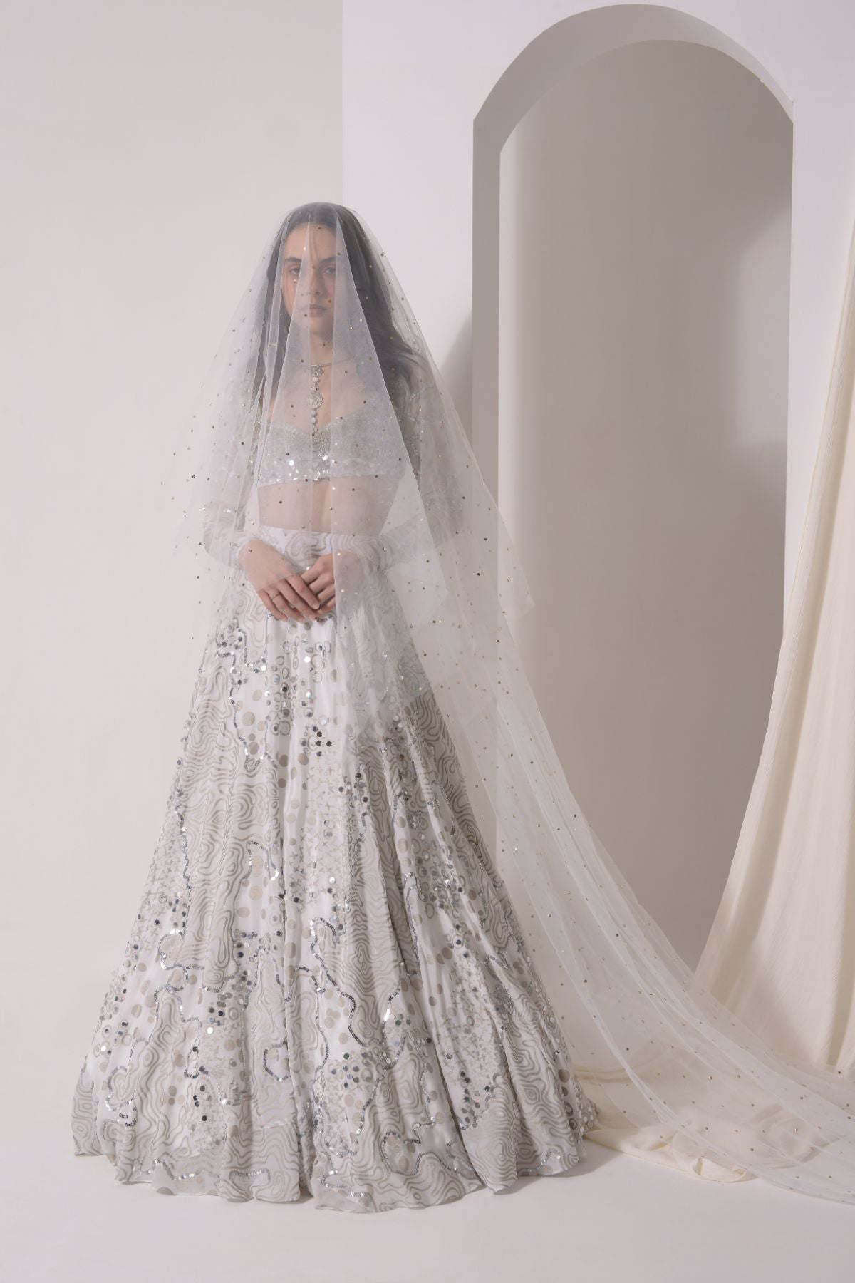 Foil twinkling lehenga with embroidered blouse and dupatta