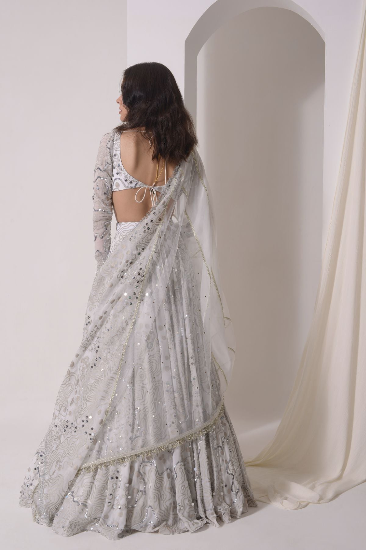 Foil twinkling lehenga with embroidered blouse and dupatta