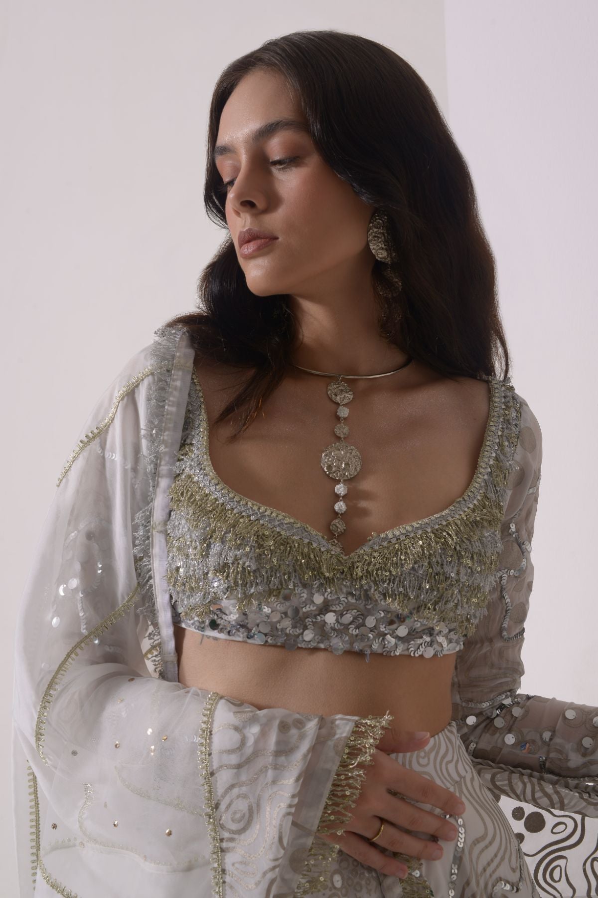 Foil twinkling lehenga with embroidered blouse and dupatta