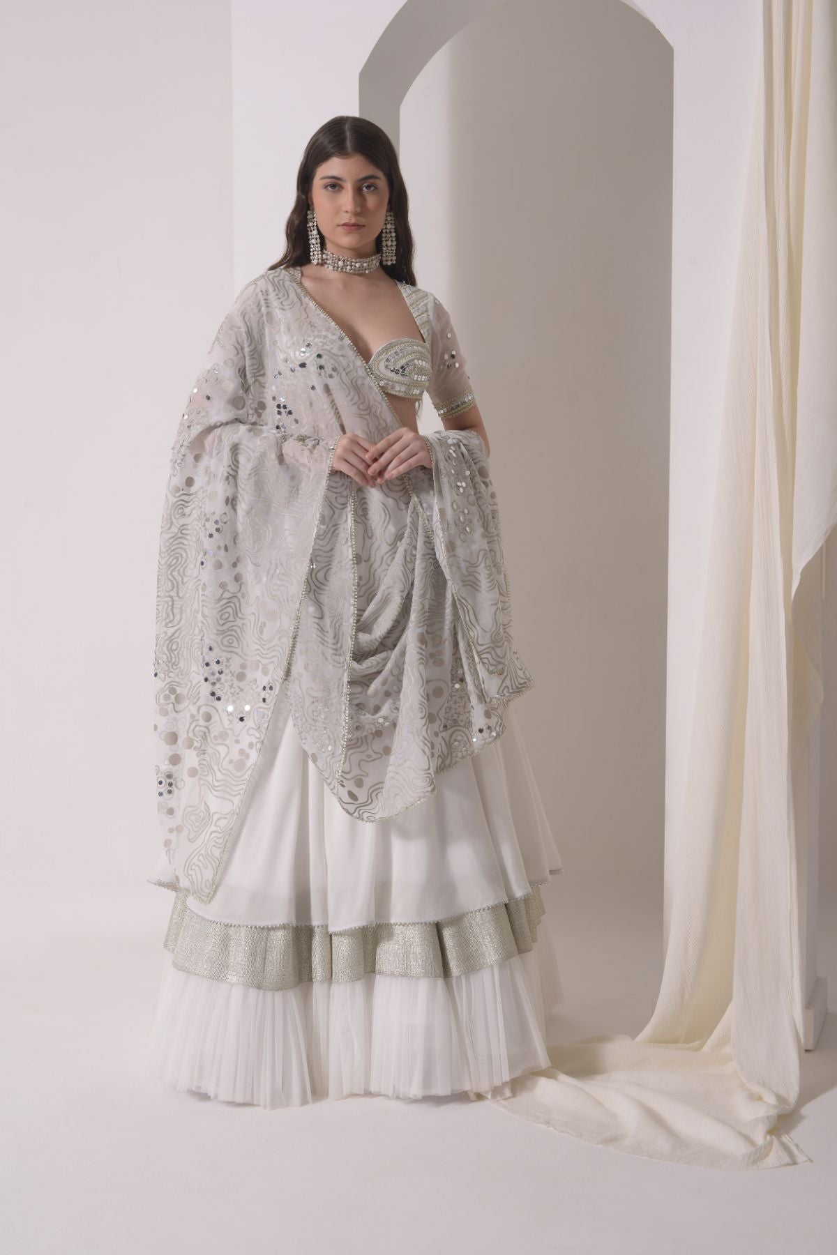Circular tiered  lehenga with embroidered blouse and foil dupatta
