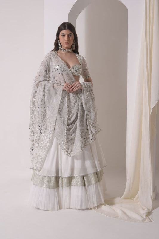 Circular tiered  lehenga with embroidered blouse and foil dupatta