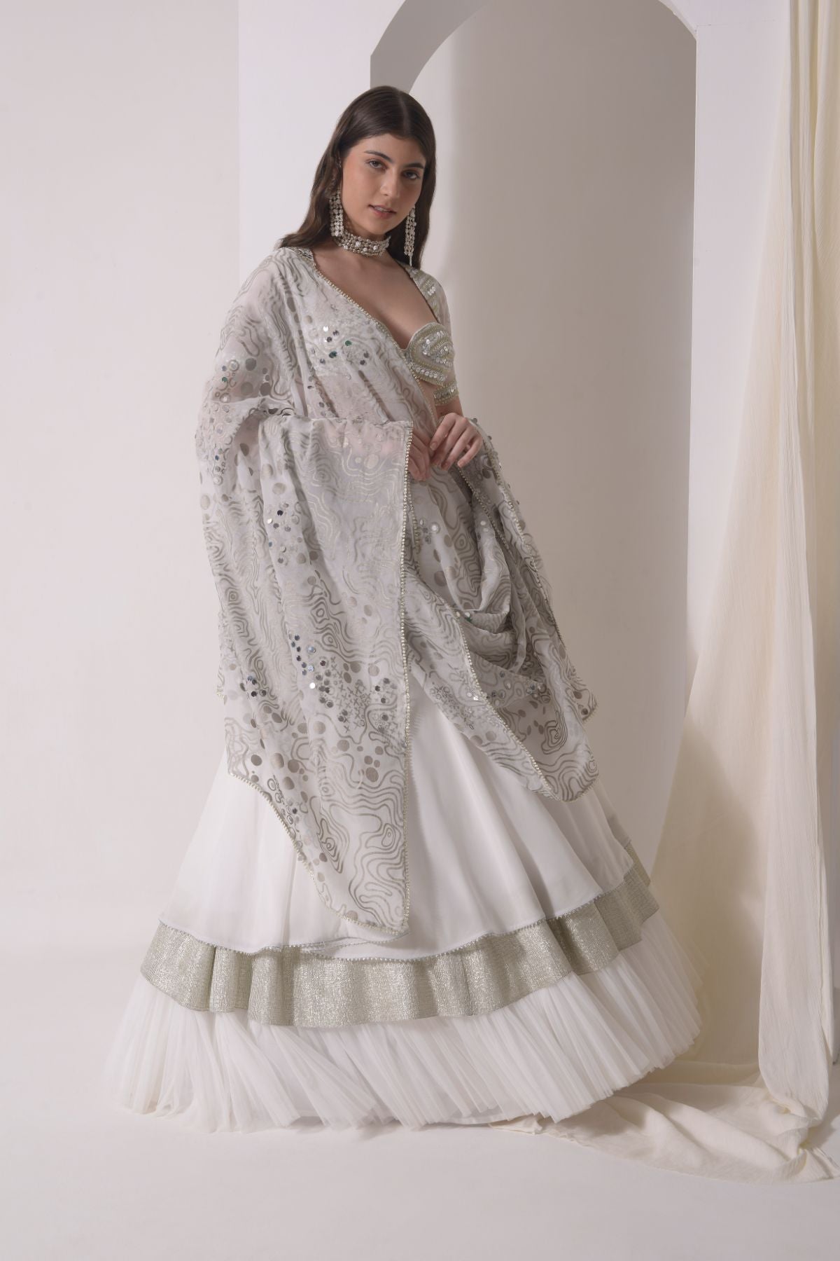 Circular tiered  lehenga with embroidered blouse and foil dupatta