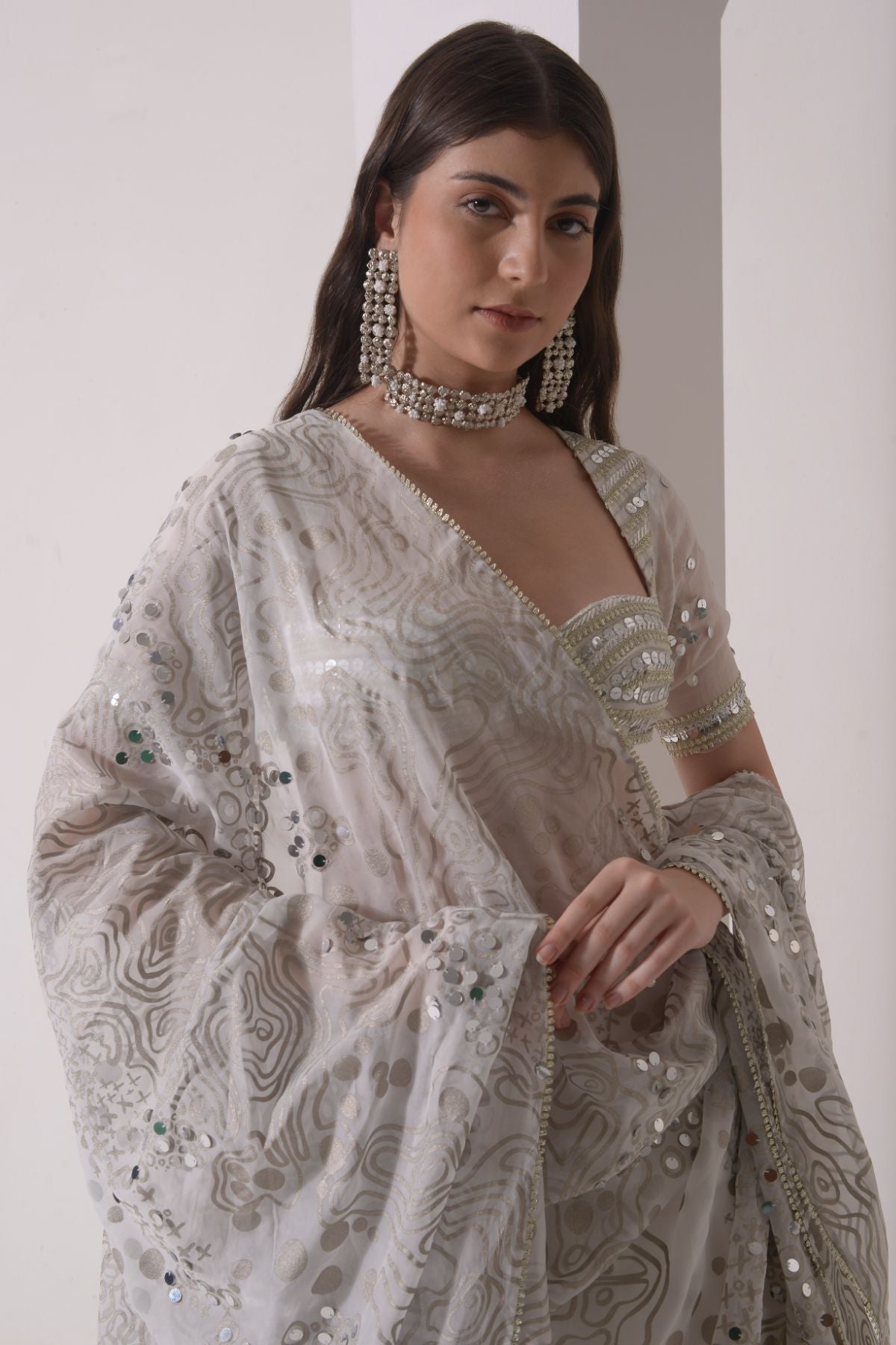 Circular tiered  lehenga with embroidered blouse and foil dupatta