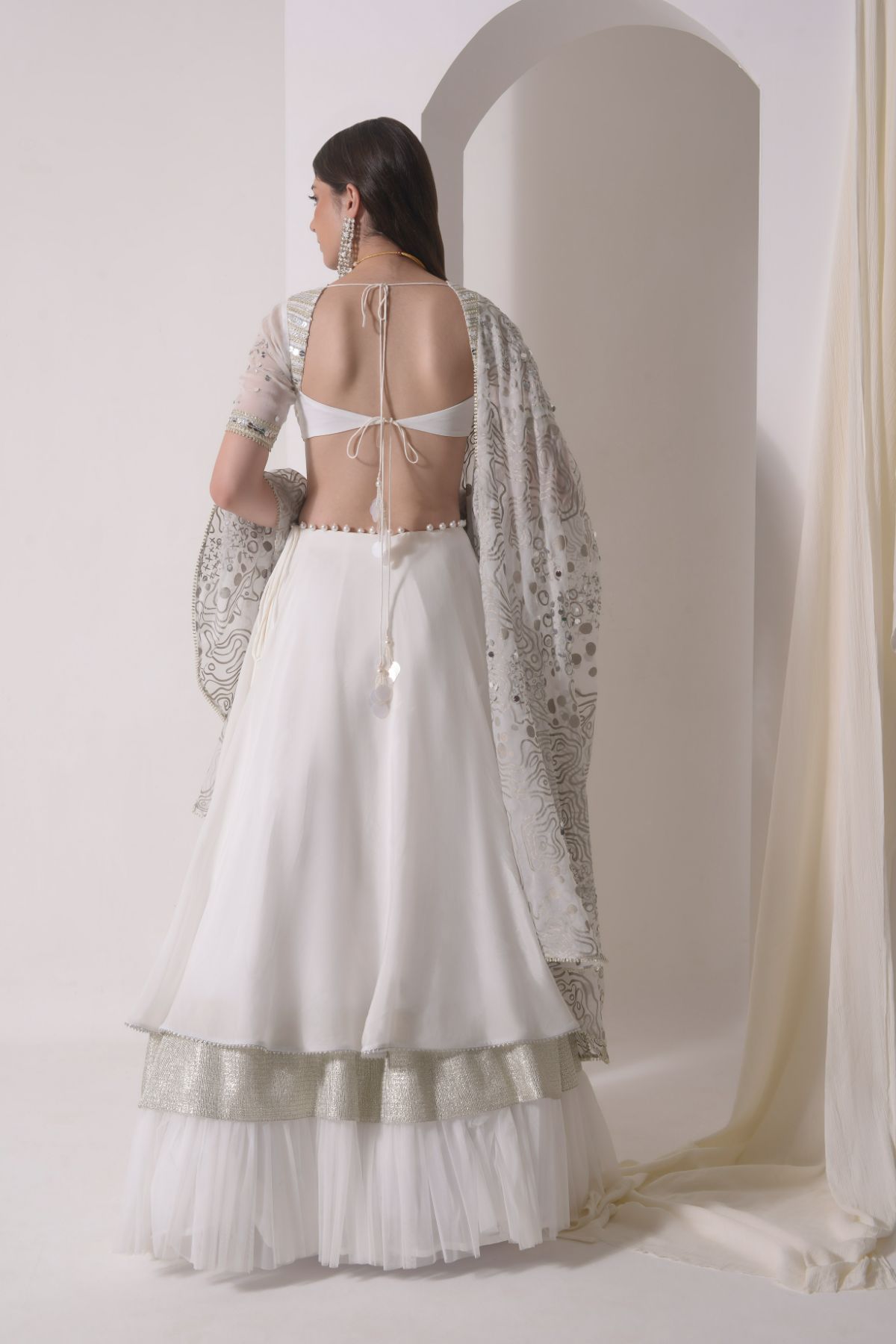 Circular tiered  lehenga with embroidered blouse and foil dupatta