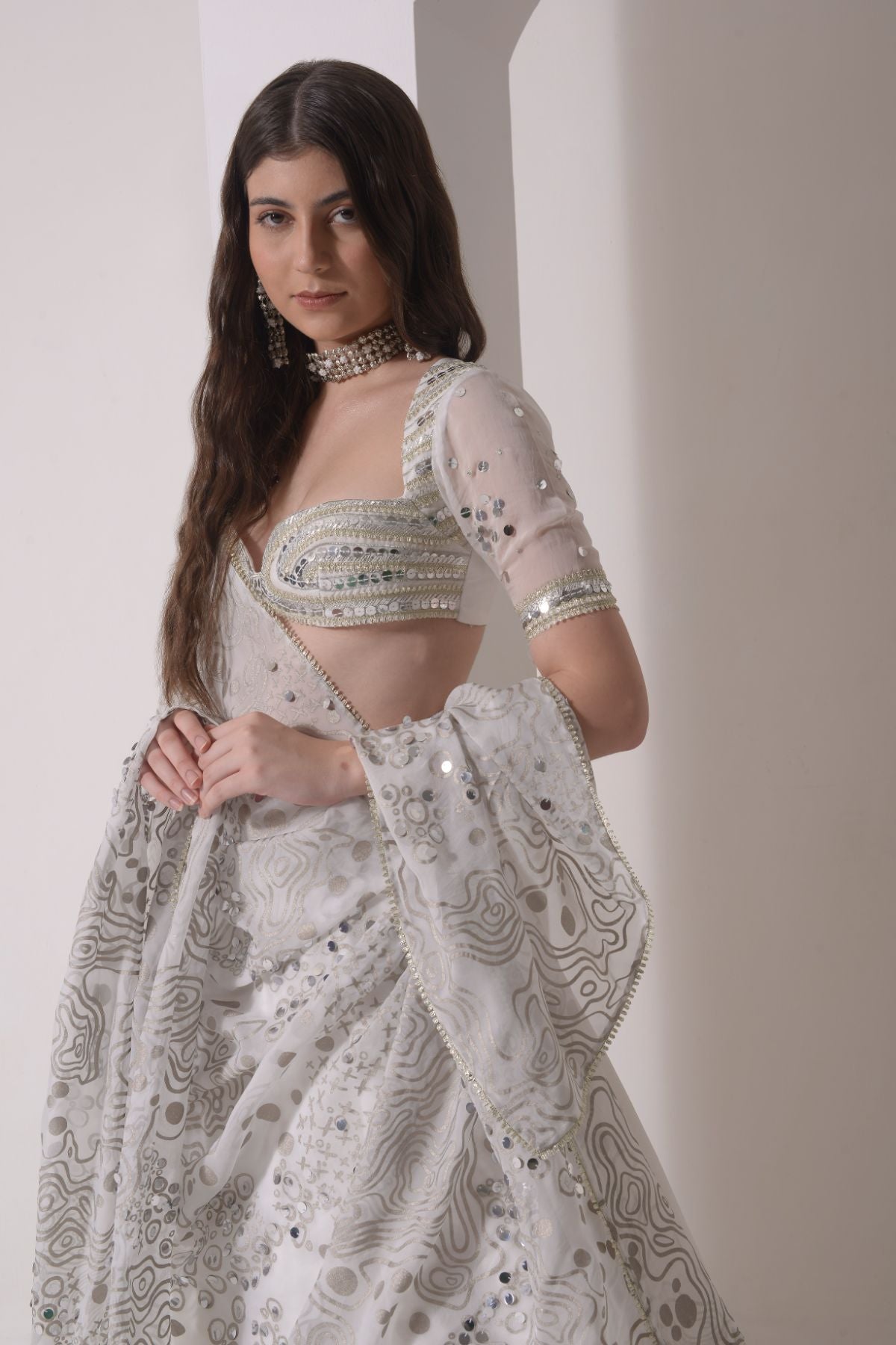 Circular tiered  lehenga with embroidered blouse and foil dupatta