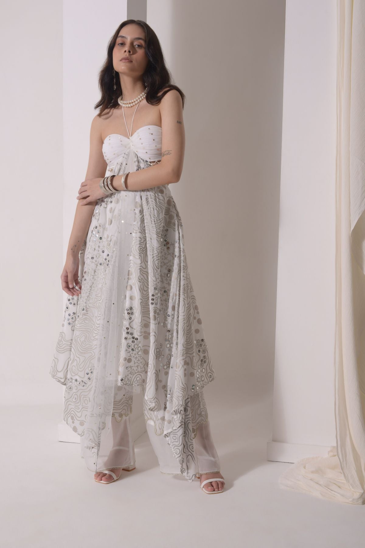 Asymmetrical ruched foil tunic with patchwork pants