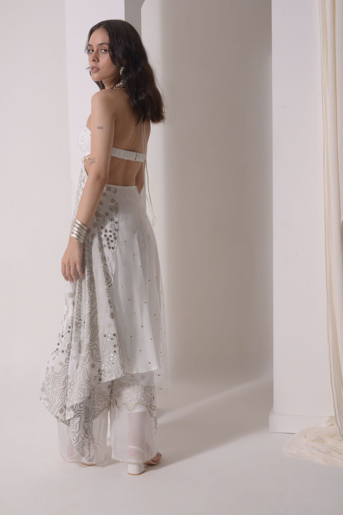 Asymmetrical ruched foil tunic with patchwork pants