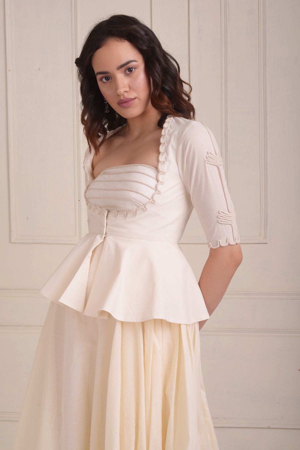 Dori embroidered peplum jacket with a gown