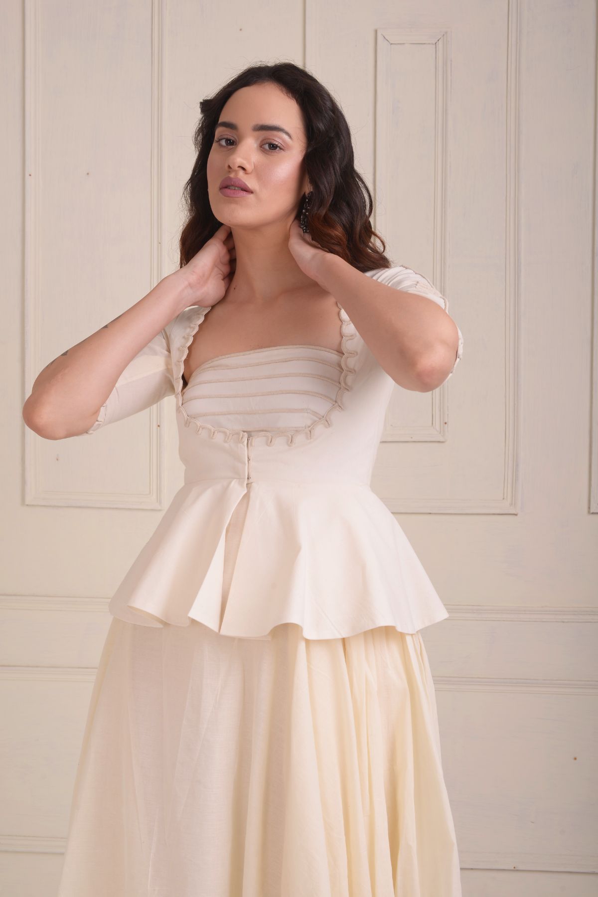 Dori embroidered peplum jacket with a gown