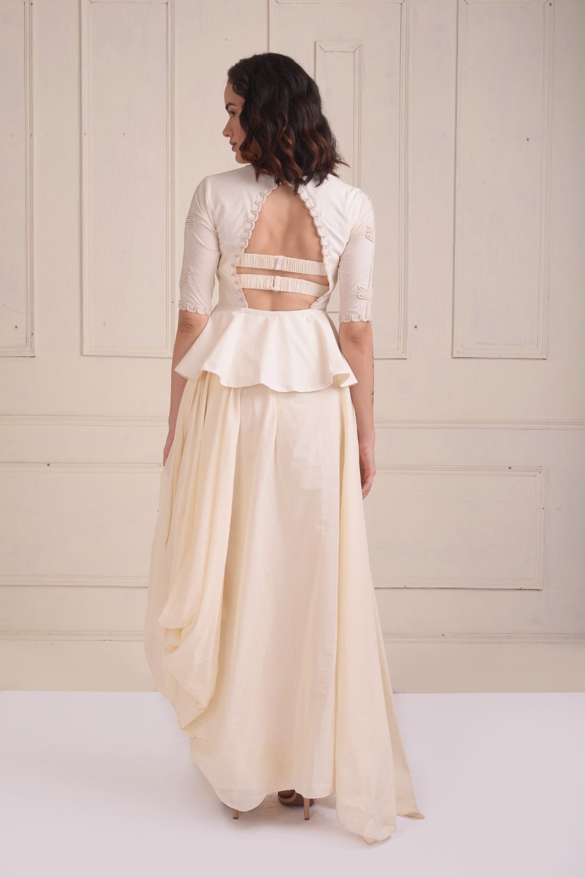 Dori embroidered peplum jacket with a gown