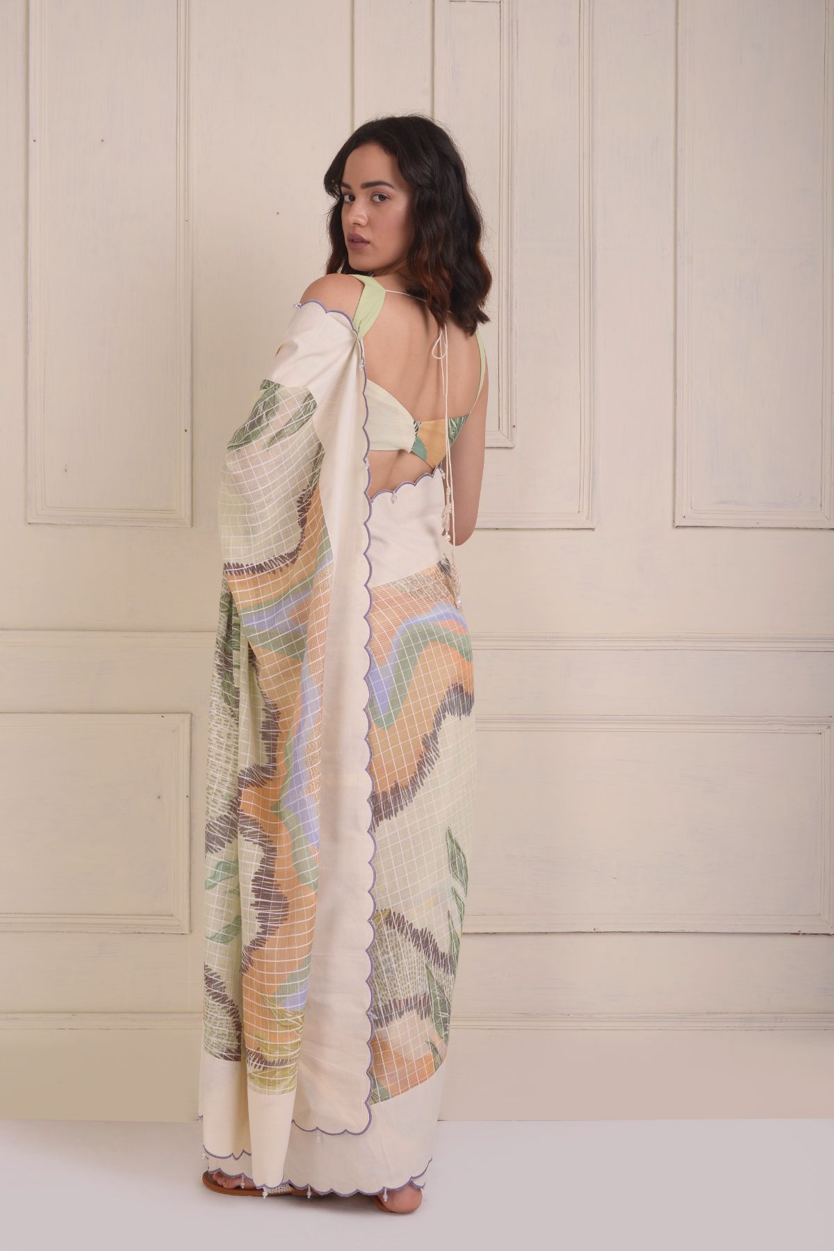 Solid scalloped border printed saree with a printed draped blouse.