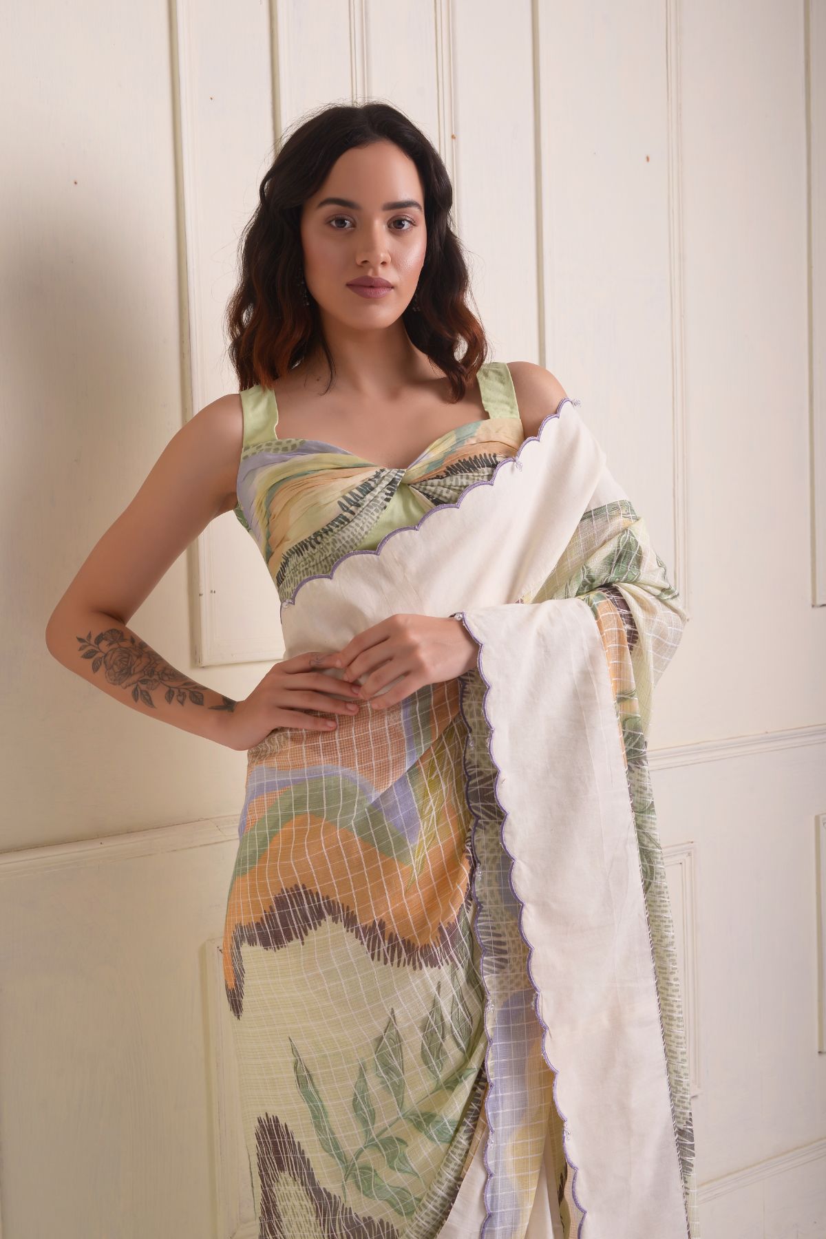 Solid scalloped border printed saree with a printed draped blouse.