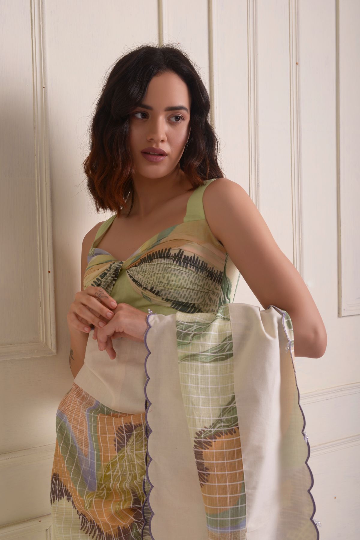 Solid scalloped border printed saree with a printed draped blouse.