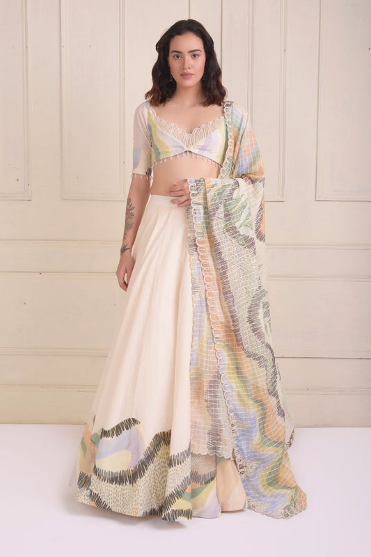 Placement patch printed lehenga with a printed scalloped neck blouse
