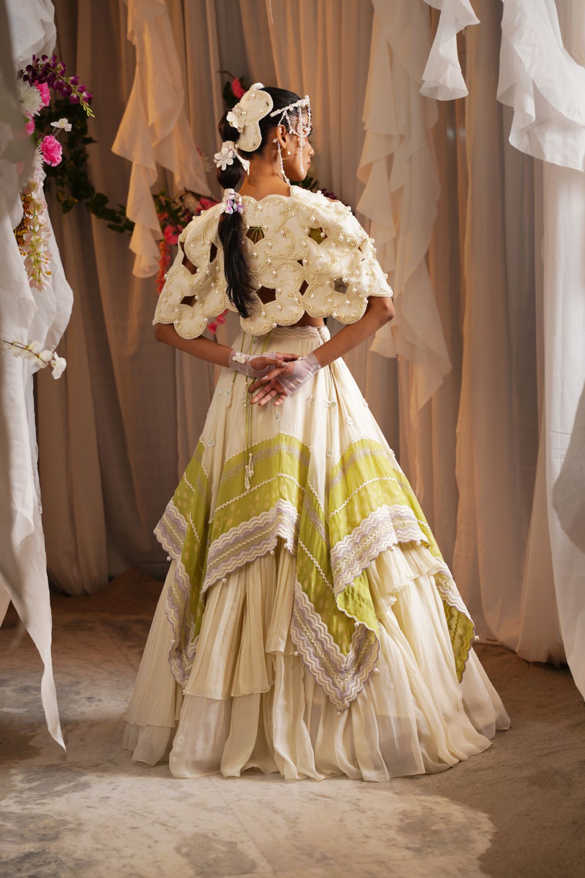 Scalloped Scarf Tier Lehenga With Draped Bustier And Floret Cutwork Cape