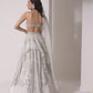 Asymmetrical layered lehenga with foil printed ruched bustier and dupatta