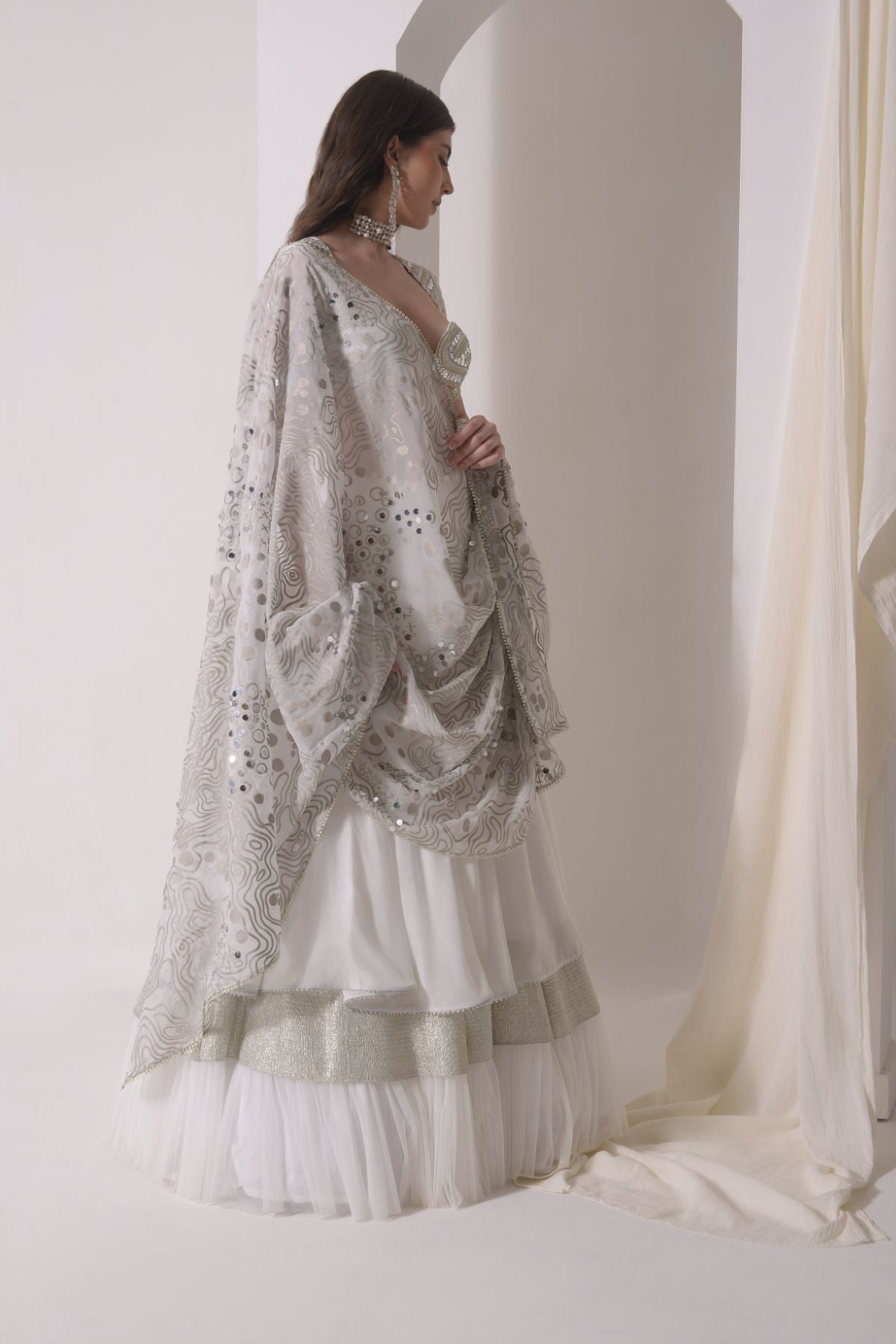 Circular tiered  lehenga with embroidered blouse and foil dupatta