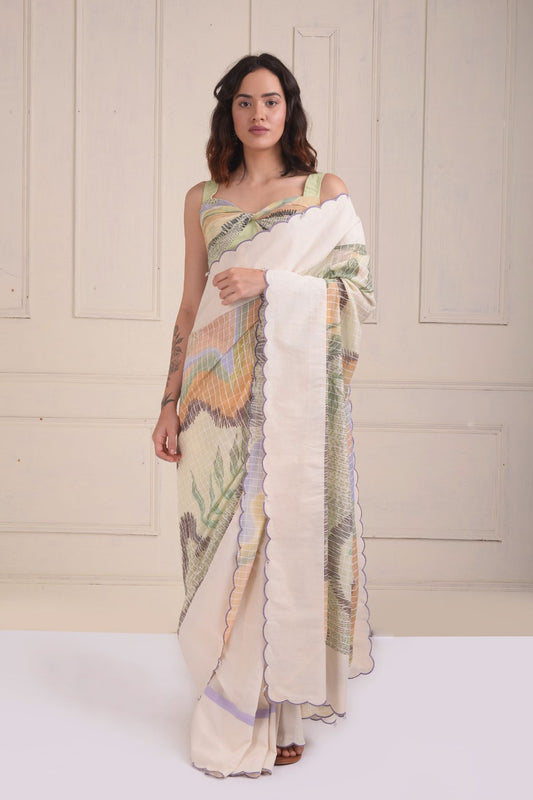 Solid scalloped border printed saree with a printed draped blouse.